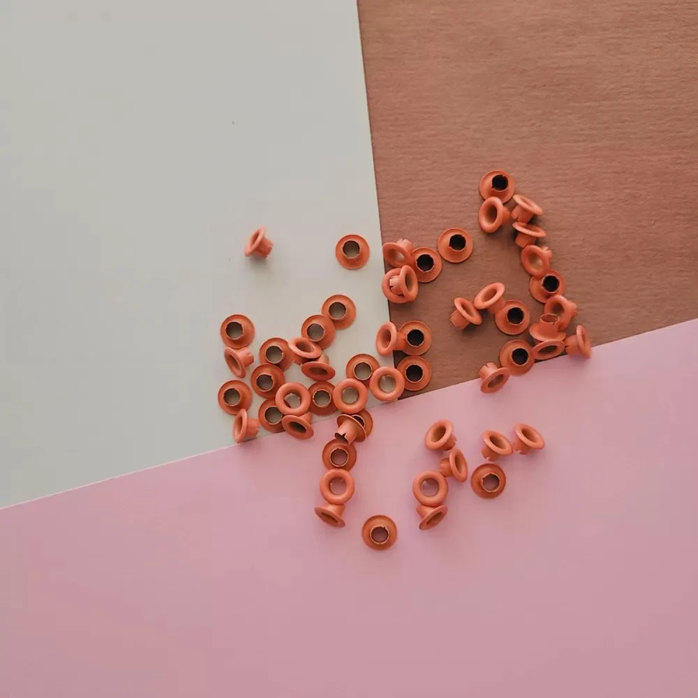 40.14.130_1000-1-1 Ojaliillos Aluminio (eyelet) 50 Pcs Naranja - Imagen 1