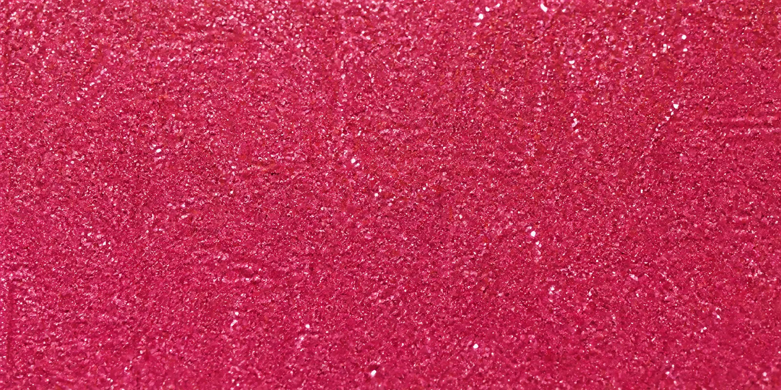 Macro del papel con glitter lavanda del bosque, con las partículas separadas brillando sobre la hoja