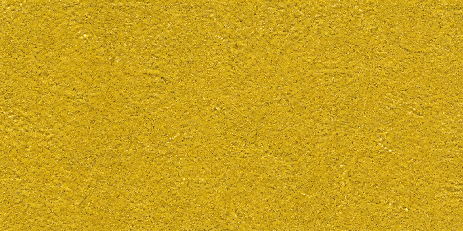 Macro del papel con glitter oro corona real, con las partículas separadas brillando sobre la hoja