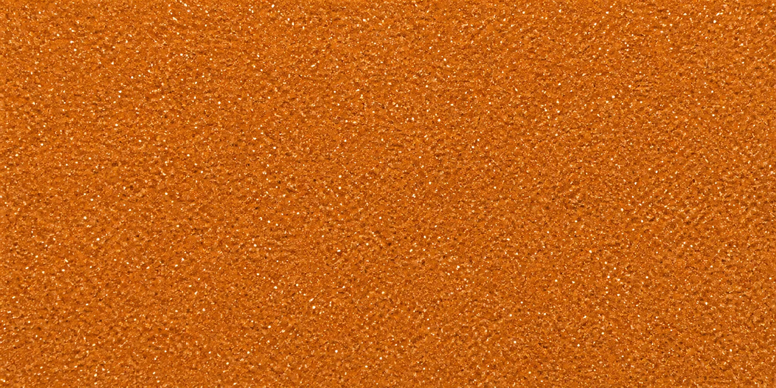 Macro del papel con glitter oro llave magica, con las partículas separadas brillando sobre la hoja