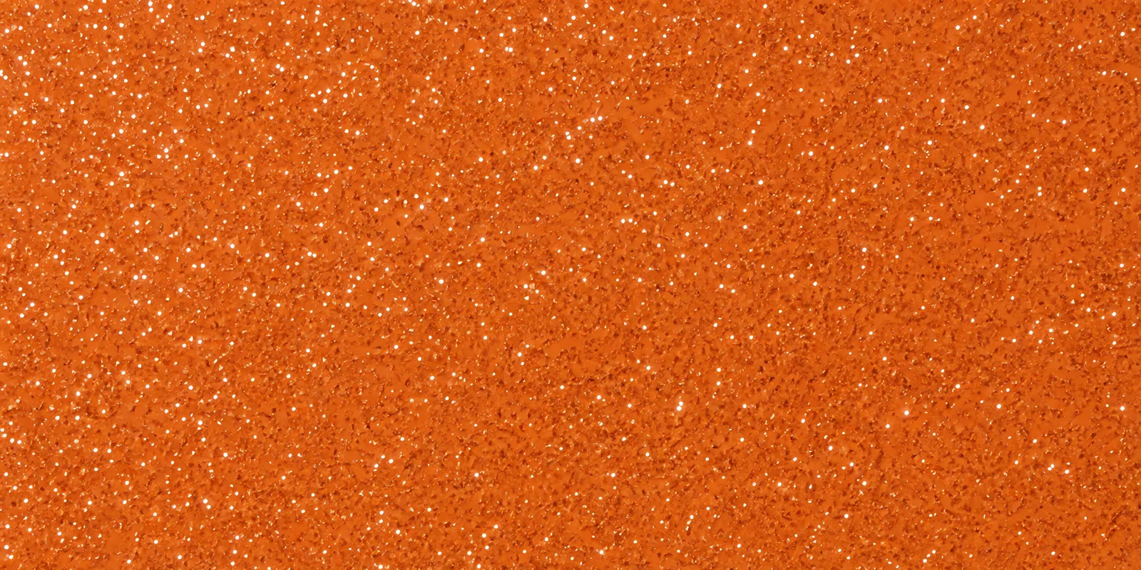 Macro de una hoja bronce de Gliterina, con el glitter bajo el film plástico