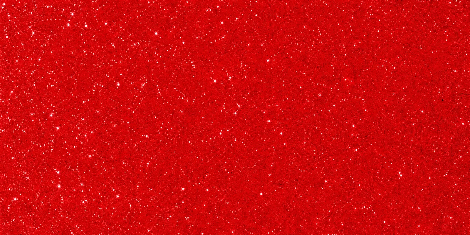 Macro de una hoja rojo escarlata de Gliterina, con el glitter bajo el film plástico