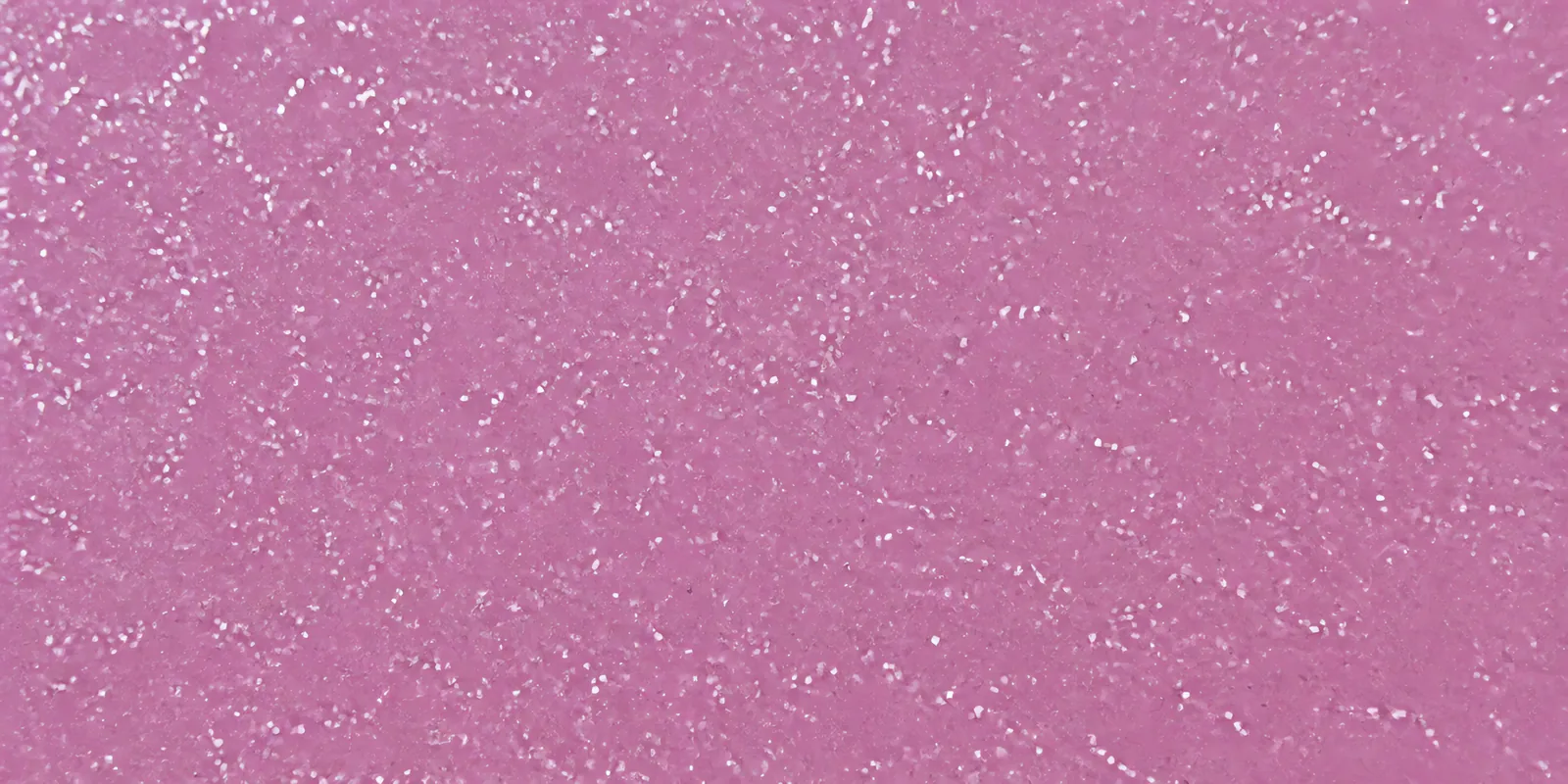 Macro de una hoja rosa perla de Gliterina, con el glitter bajo el film plástico
