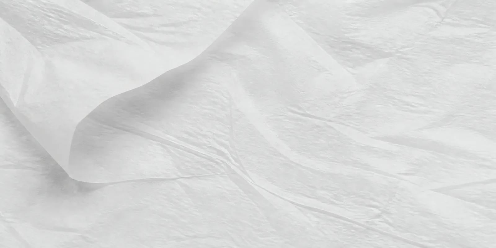 Textura del papel seda blanco, con sus arrugas finas y sus pliegues