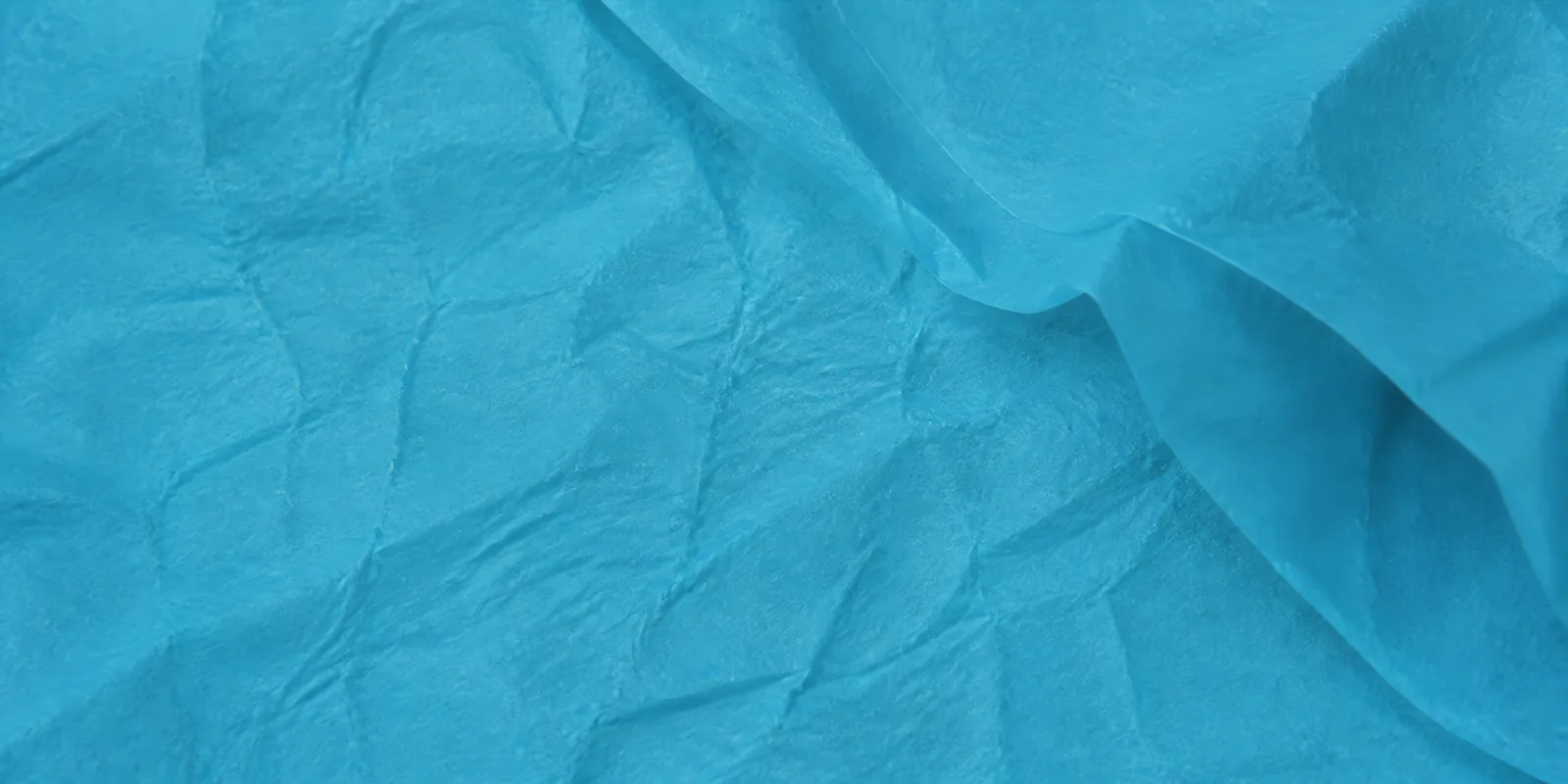Textura del papel seda celeste encantado, con sus arrugas finas y sus pliegues