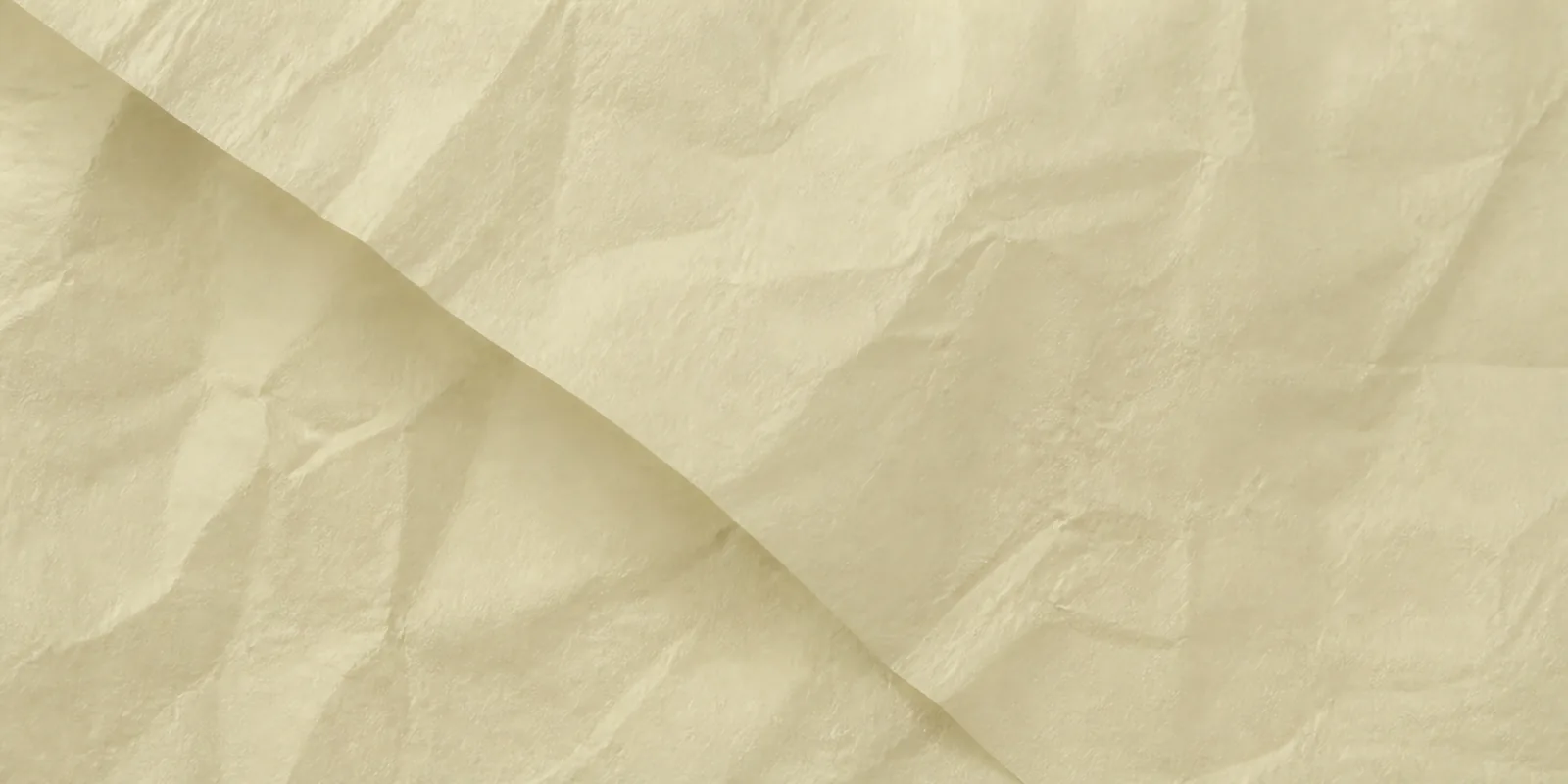Textura del papel seda crudo, con sus arrugas finas y sus pliegues