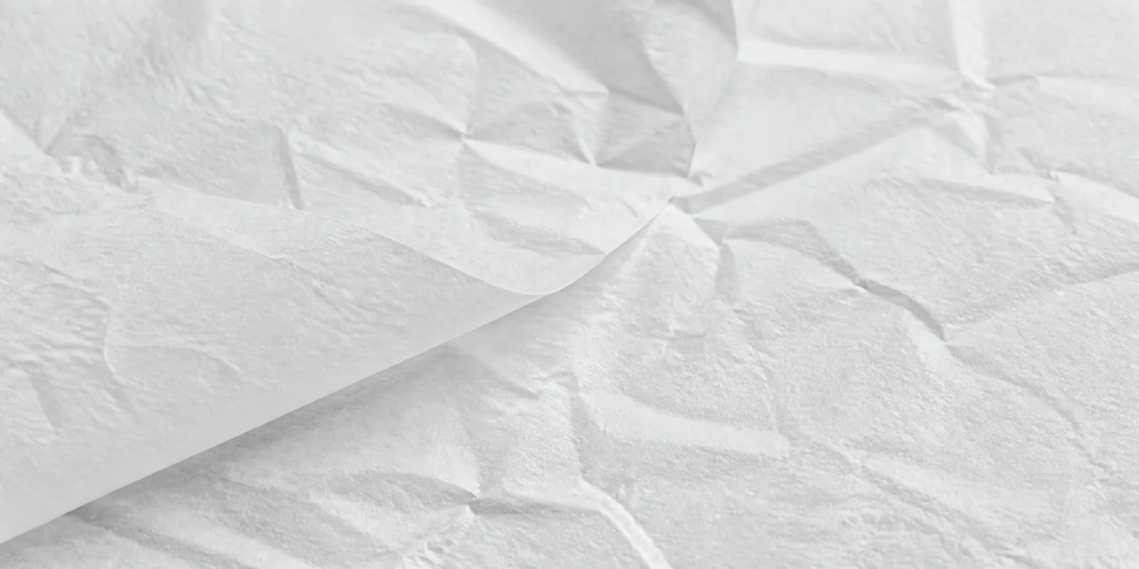Textura del papel seda gris acero, con sus arrugas finas y sus pliegues