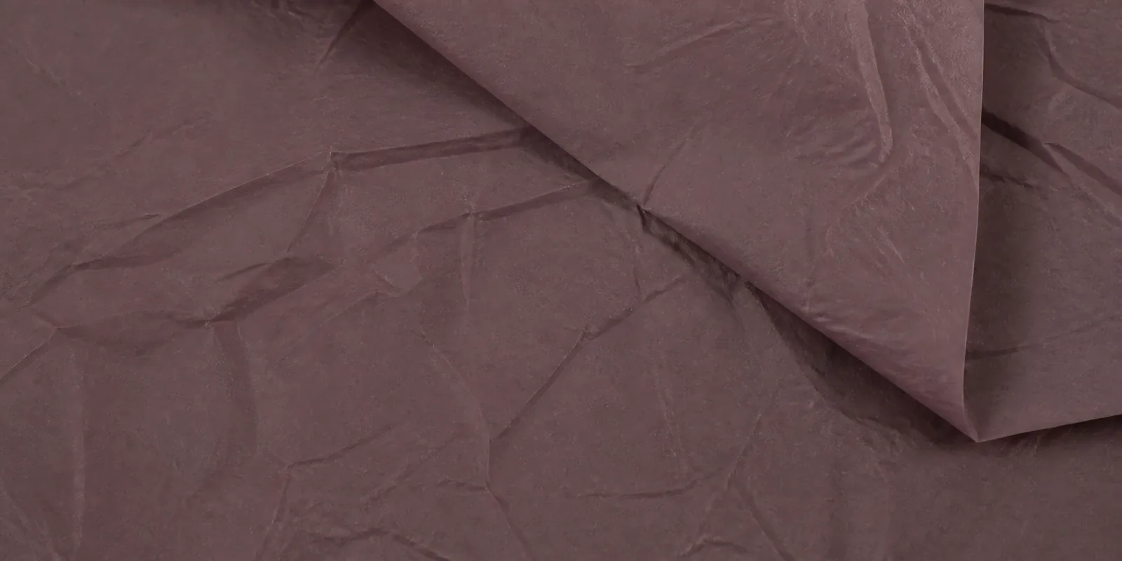 Textura del papel seda marrón grisáceo, con sus arrugas finas y sus pliegues