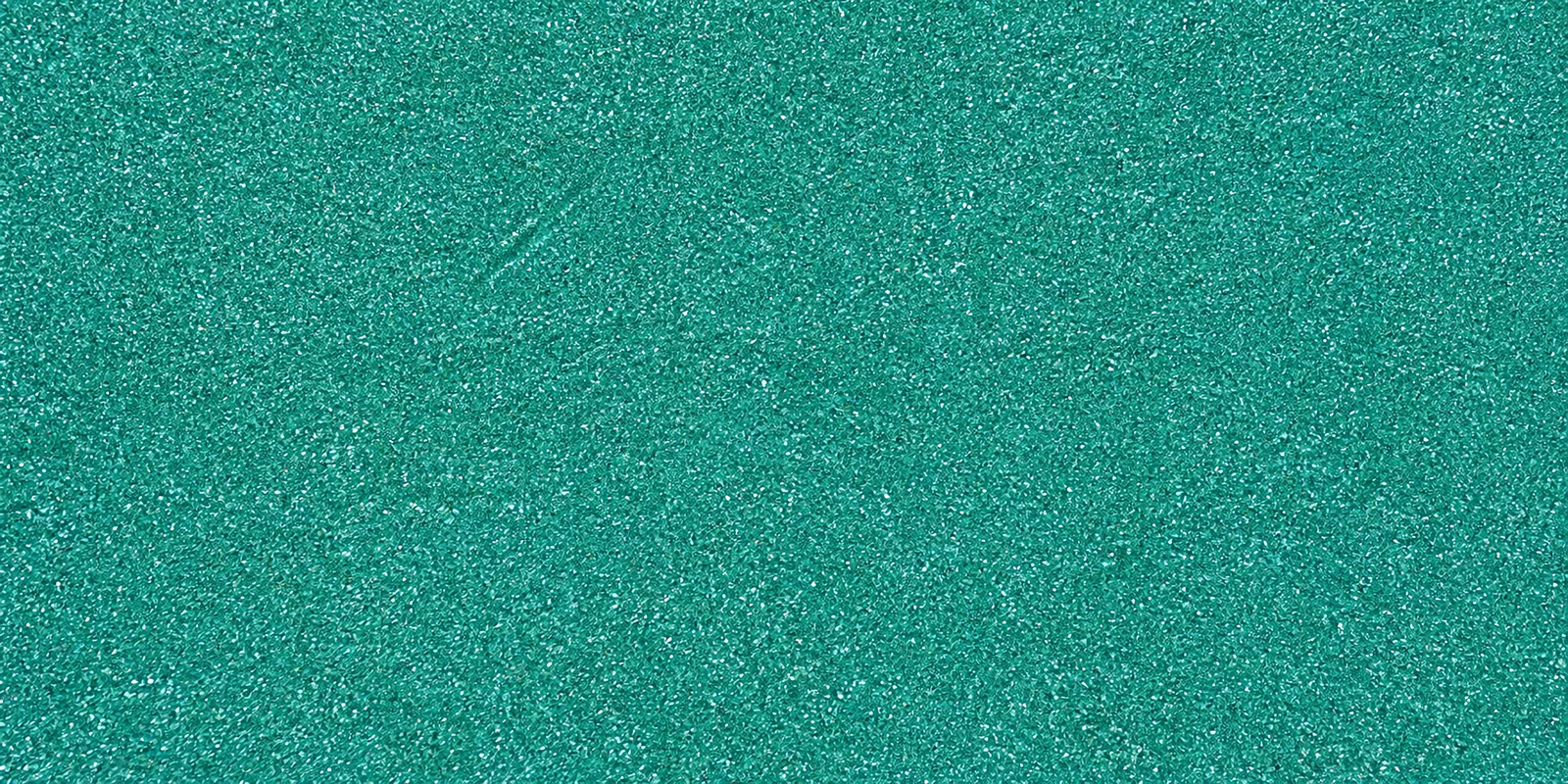 Macro del papel con glitter azul alas de hada, con las partículas separadas brillando sobre la hoja