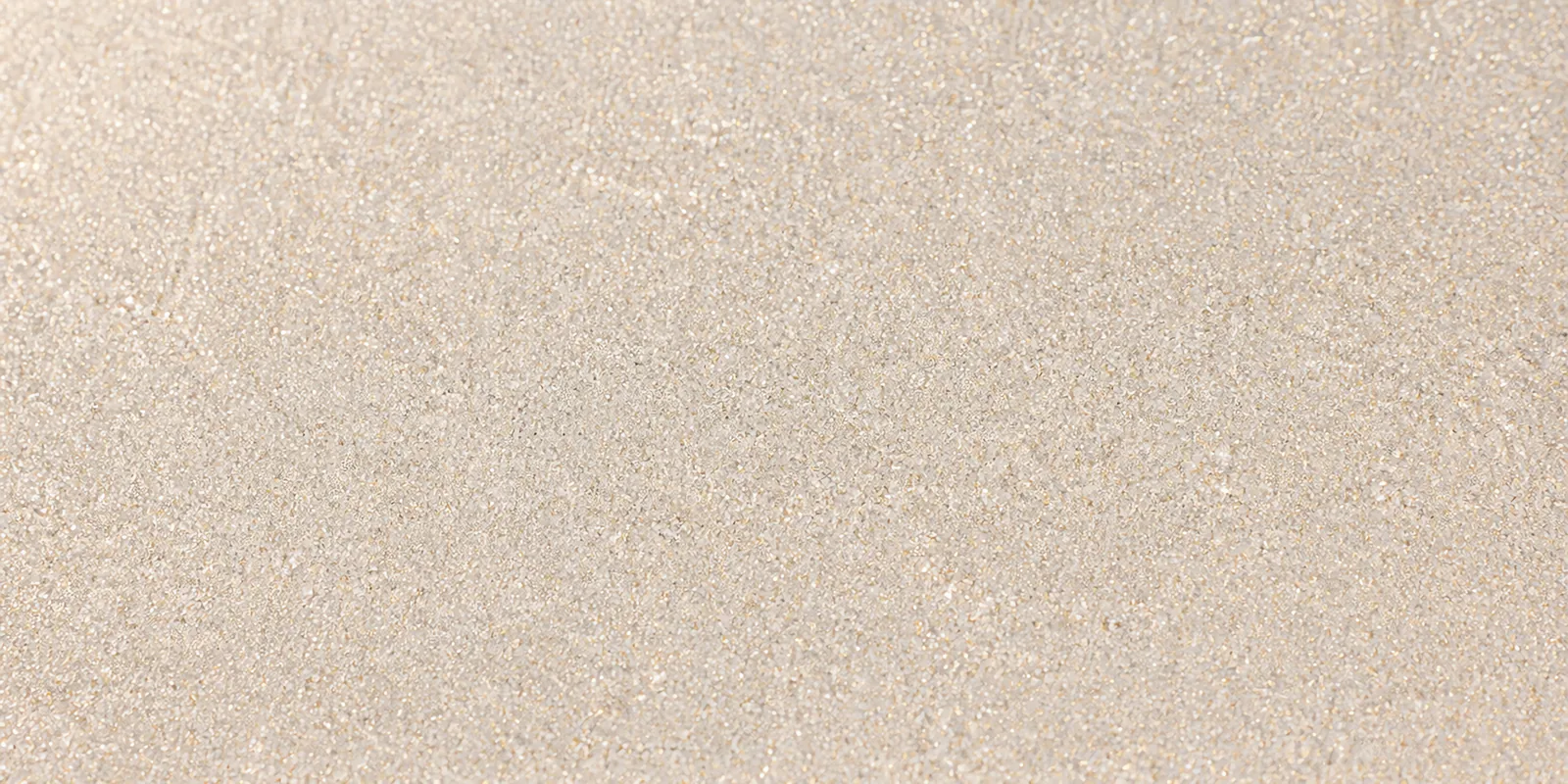 Macro del papel con glitter blanco palacio polar, con las partículas separadas brillando sobre la hoja