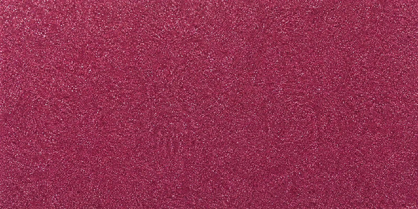 Macro del papel con glitter violeta alfombra magica, con las partículas separadas brillando sobre la hoja
