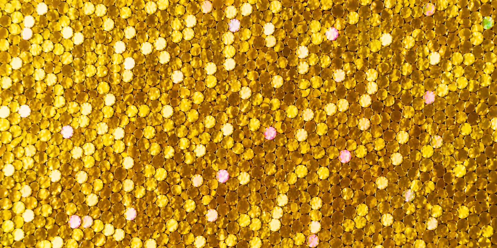 Detalle del papel Glamurina en el tono dorado ari, con las escamas de glitter a la vista