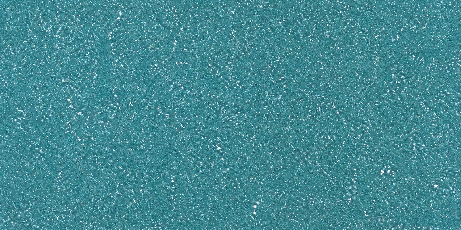 Macro de una hoja celeste lluvia de Gliterina, con el glitter bajo el film plástico