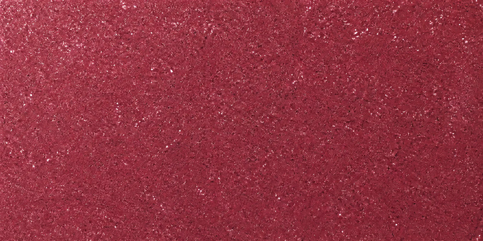 Macro de una hoja rosa chicle de Gliterina, con el glitter bajo el film plástico