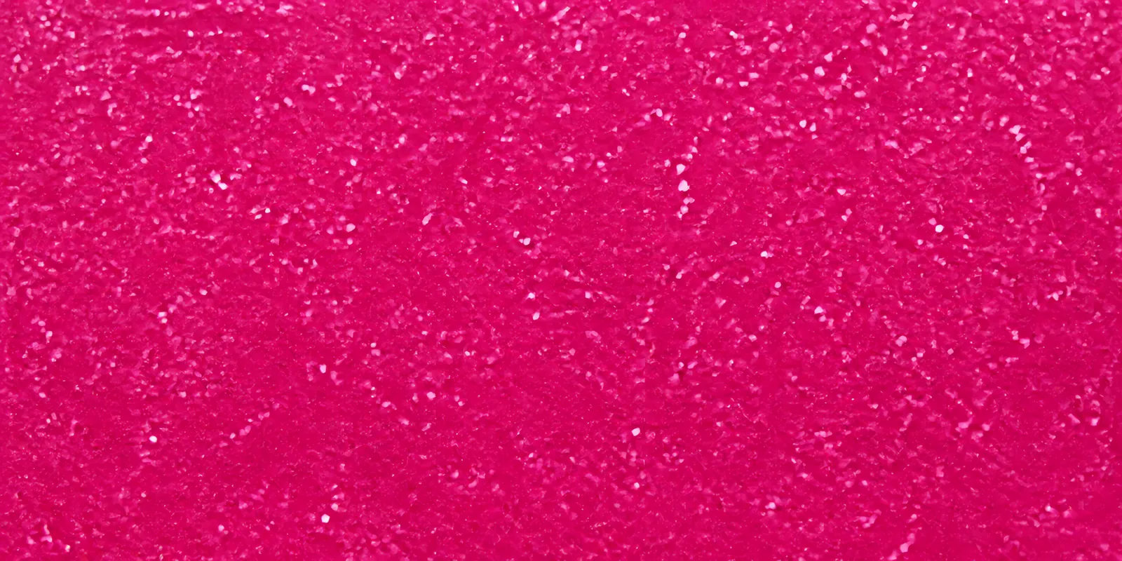 Macro de una hoja rosa neon de Gliterina, con el glitter bajo el film plástico