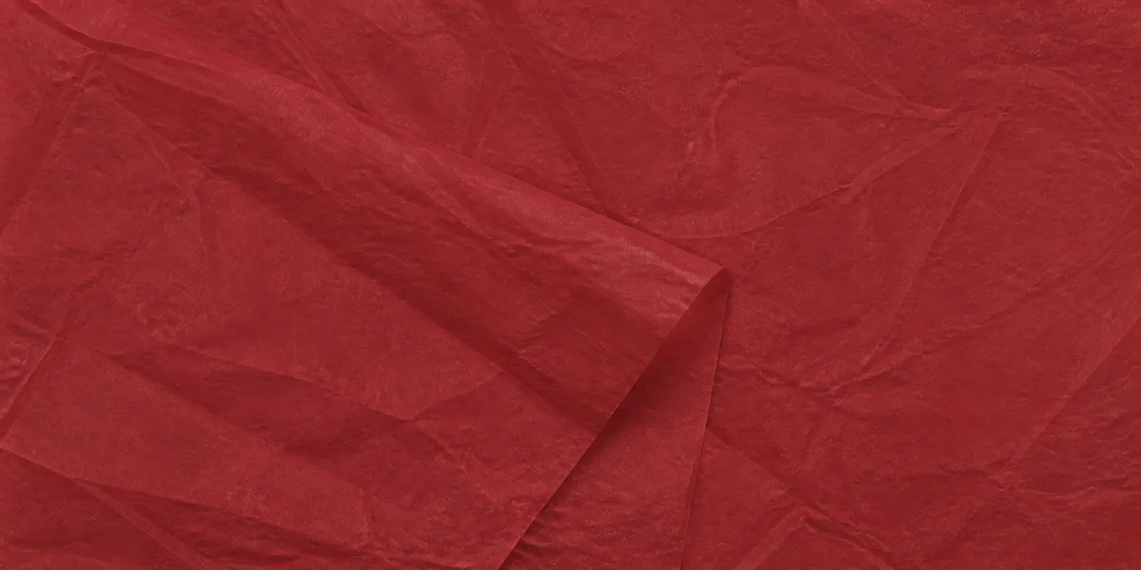 Textura del papel seda bordo, con sus arrugas finas y sus pliegues